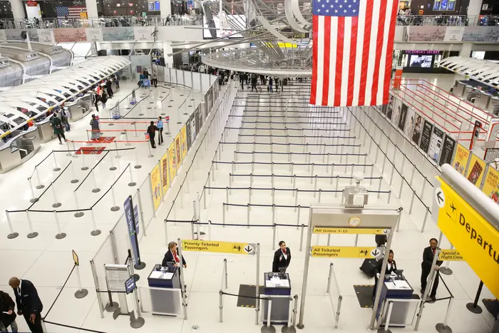 A photograph of a relatively empty TSA screening area at JFK airport on March 13th.